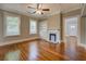 Inviting living room with hardwood floors, fireplace, and natural light at 31 N Broad N St, Porterdale, GA 30014