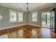 Spacious living room showcasing original hardwood floors, and bright natural light at 31 N Broad N St, Porterdale, GA 30014
