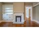 Living room featuring a fireplace, built-in shelving, and hardwood floors at 31 N Broad N St, Porterdale, GA 30014