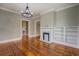 Bright living room with hardwood floors, fireplace, and built-in shelves at 31 N Broad N St, Porterdale, GA 30014