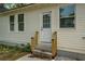 The side entrance boasts new steps and railing at 31 N Broad N St, Porterdale, GA 30014