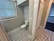 Toilet room with black and white patterned tile floor and modern fixtures at 31 N Broad N St, Porterdale, GA 30014