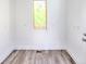 Bright room with light-colored wood floors and a window providing natural light at 727 Copper Trace Way, Woodstock, GA 30189