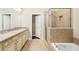 Bathroom with double vanity, soaking tub, and glass shower at 255 Kendemere Pointe, Roswell, GA 30075