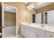 Double vanity bathroom with access to bedroom and hallway at 255 Kendemere Pointe, Roswell, GA 30075