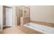 Spa-like bathroom with soaking tub and walk-in shower at 255 Kendemere Pointe, Roswell, GA 30075