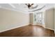 Large bedroom with hardwood floors, ceiling fan, and bay window at 255 Kendemere Pointe, Roswell, GA 30075