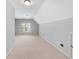 Bright bedroom with vaulted ceiling, neutral walls, carpet flooring, and window with shutters at 255 Kendemere Pointe, Roswell, GA 30075