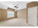 Well-lit bedroom with ceiling fan and plantation shutters at 255 Kendemere Pointe, Roswell, GA 30075