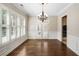 Formal dining room with hardwood floors and plantation shutters at 255 Kendemere Pointe, Roswell, GA 30075