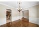 Spacious dining room with hardwood floors and chandelier at 255 Kendemere Pointe, Roswell, GA 30075