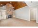 Gathering room with stone fireplace and built-in shelving at 255 Kendemere Pointe, Roswell, GA 30075