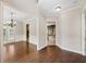 Hardwood floor hallway leading to the dining room and kitchen at 255 Kendemere Pointe, Roswell, GA 30075