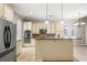 Spacious kitchen with island, stainless steel appliances, and ample cabinetry at 255 Kendemere Pointe, Roswell, GA 30075