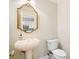 Elegant powder room with pedestal sink and toilet at 255 Kendemere Pointe, Roswell, GA 30075