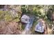 An aerial view of the residence, showing the yard, driveway, and detached garage at 2020 Kenwood Se Pl, Smyrna, GA 30082