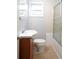 Bathroom featuring tile floors, vanity with sink, toilet and shower with glass doors at 2020 Kenwood Se Pl, Smyrna, GA 30082