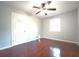 Bedroom with hardwood floors, neutral walls, a ceiling fan and a window for natural light at 2020 Kenwood Se Pl, Smyrna, GA 30082