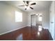 Bright bedroom with hardwood floors, ceiling fan, a window and a mirrored closet at 2020 Kenwood Se Pl, Smyrna, GA 30082