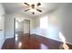 Bedroom with hardwood floors, mirrored closet and a ceiling fan at 2020 Kenwood Se Pl, Smyrna, GA 30082