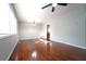 Sunlit living room with hardwood floors, ceiling fan and neutral paint; a blank canvas for personalization and decor at 2020 Kenwood Se Pl, Smyrna, GA 30082