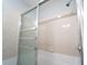 Close up of a shower featuring glass doors and tiled walls at 2020 Kenwood Se Pl, Smyrna, GA 30082