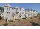 Row of charming townhouses with gray siding and black accents at 3304 Cranston Ln, Kennesaw, GA 30144