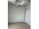 Bedroom features neutral gray walls, white trim, and bright light coming in from window at 108 Cottage Gate Ln, Roswell, GA 30076