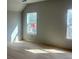 Bright bedroom with hardwood floors and natural light streaming through the windows at 108 Cottage Gate Ln, Roswell, GA 30076