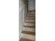 View of new staircase with natural wood treads and white risers at 108 Cottage Gate Ln, Roswell, GA 30076