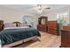 Spacious primary bedroom with ample light and wood flooring at 3189 Bellgreen Way, Decatur, GA 30032