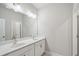 Bathroom featuring double sinks, vanity and large mirror at 5133 Greenard Watson Lane, Buford, GA 30518