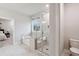 Modern bathroom featuring a glass enclosed shower, separate tub, and tile flooring at 5133 Greenard Watson Lane, Buford, GA 30518