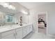 Bright bathroom with double sinks, modern fixtures, walk-in shower and bright light at 5133 Greenard Watson Lane, Buford, GA 30518