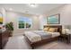 Comfortable bedroom with a large window that lets in plenty of natural light and stylish decor at 5133 Greenard Watson Lane, Buford, GA 30518