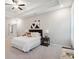Spacious bedroom showcasing ceiling fan, plush carpet and decorative elements at 5133 Greenard Watson Lane, Buford, GA 30518