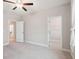 Spacious bedroom featuring neutral paint, carpet flooring and a walk-in closet at 5133 Greenard Watson Lane, Buford, GA 30518
