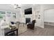 Comfortable living room with a fireplace, built-in shelves, and ample seating at 5133 Greenard Watson Lane, Buford, GA 30518
