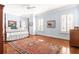 Spacious bedroom with hardwood floors, a four-poster bed, and an area rug at 3657 Peachtree Ne Rd # 2C, Atlanta, GA 30319