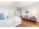 Bedroom with hardwood floors, seating area, and a four-poster bed at 3657 Peachtree Ne Rd # 2C, Atlanta, GA 30319