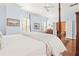 Main bedroom with hardwood floors, a four-poster bed, and access to other rooms at 3657 Peachtree Ne Rd # 2C, Atlanta, GA 30319