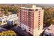 Brick building with balconies and trees at 3657 Peachtree Ne Rd # 2C, Atlanta, GA 30319