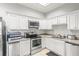 Modern community kitchen with stainless steel appliances at 3657 Peachtree Ne Rd # 2C, Atlanta, GA 30319