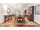 Elegant dining room featuring hardwood floors and a large mirror at 3657 Peachtree Ne Rd # 2C, Atlanta, GA 30319