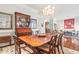 Bright dining room with hardwood floors, chandelier, and views into living room at 3657 Peachtree Ne Rd # 2C, Atlanta, GA 30319