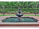 Ornate tiered fountain in a brick courtyard at 3657 Peachtree Ne Rd # 2C, Atlanta, GA 30319