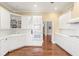 Modern kitchen with white cabinets, stainless steel appliances, and hardwood floors at 3657 Peachtree Ne Rd # 2C, Atlanta, GA 30319