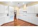 Modern kitchen with white cabinets and gas cooktop at 3657 Peachtree Ne Rd # 2C, Atlanta, GA 30319