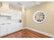 Well-equipped kitchen with white cabinets, gas cooktop, and hardwood floors at 3657 Peachtree Ne Rd # 2C, Atlanta, GA 30319