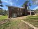 Brick home featuring a deck and patio area overlooking a private backyard and garden at 6595 Malvin Dr, Austell, GA 30168